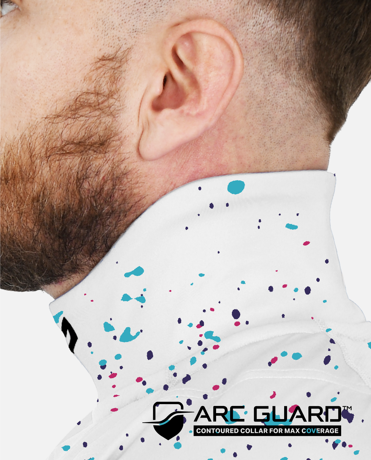 Close-up of a man wearing a white shirt with colorful speckles and 'Arc Guard' branding.