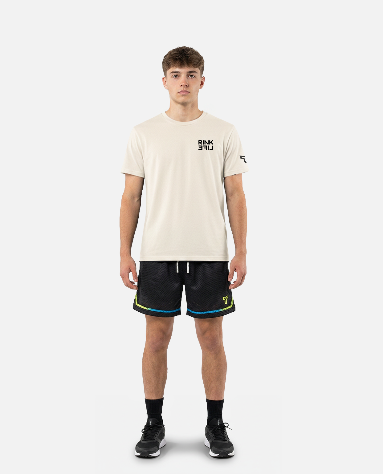 male model wearing titan battlegear black shorts with colorful trim on a light gray background