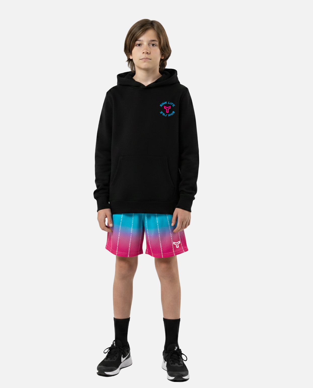 Child wearing a black t-shirt with 'Titan' logo and colorful titan battlegear shorts on a white background