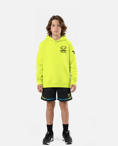 Child wearing a titan battlegear black t-shirt and shorts with a logo on a white background