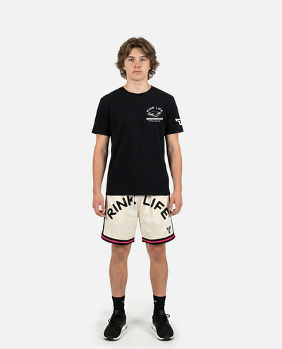 male model wearing titan battlegear beige shorts with 'RINK LIFE' text on a white background