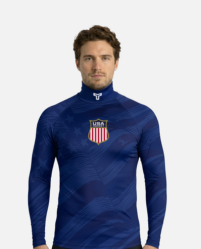 Man wearing a Blue hockey neck guard shirt with USA emblem on a white background
